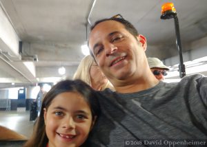 Father and Daughter Ride Golf Cart in Atlanta Airport